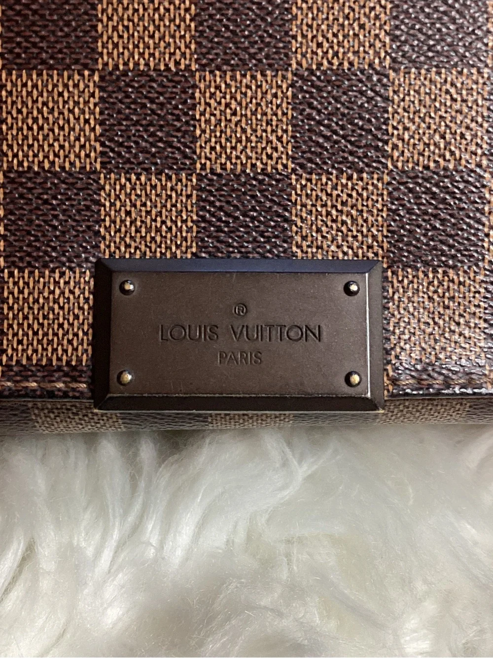 Louis Vuitton Damier Ebene District MM messenger bag.